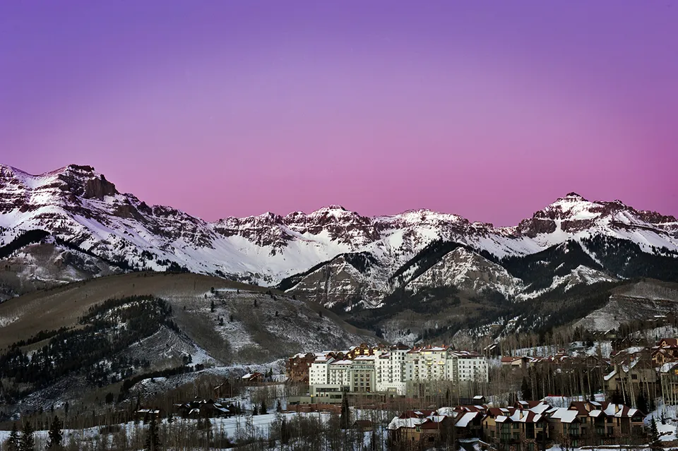 Snowcapped mountains at sunset in Colorado.